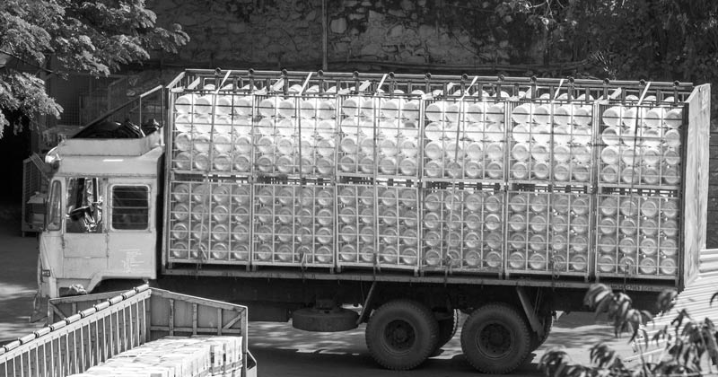 Truck carrying one of those reputed brands of bottled water which boast of selling 'mountain/spring water' with high mineral content. But in reality, these bottles may be filled with city water derived from either groundwater or tap water supply